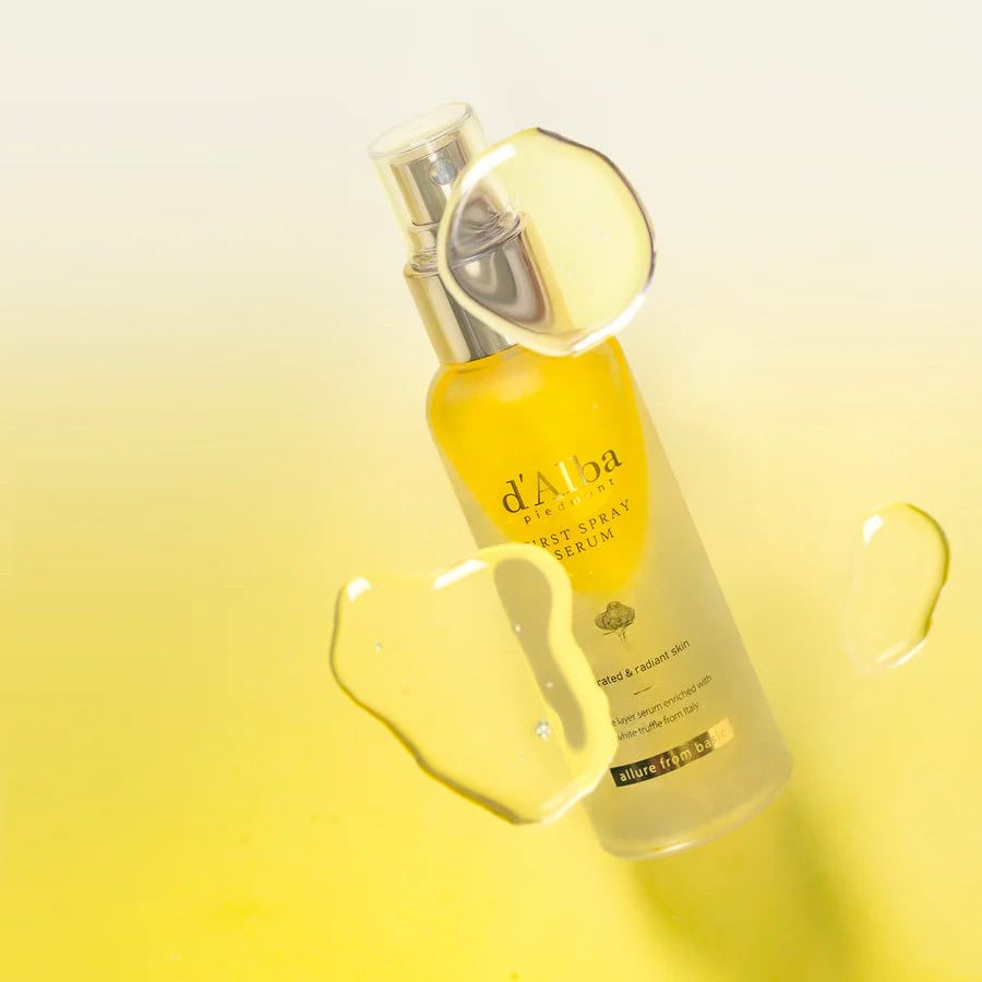 d'Alba Piedmont First Spray Serum - Model Holding Bottle Against Yellow Background