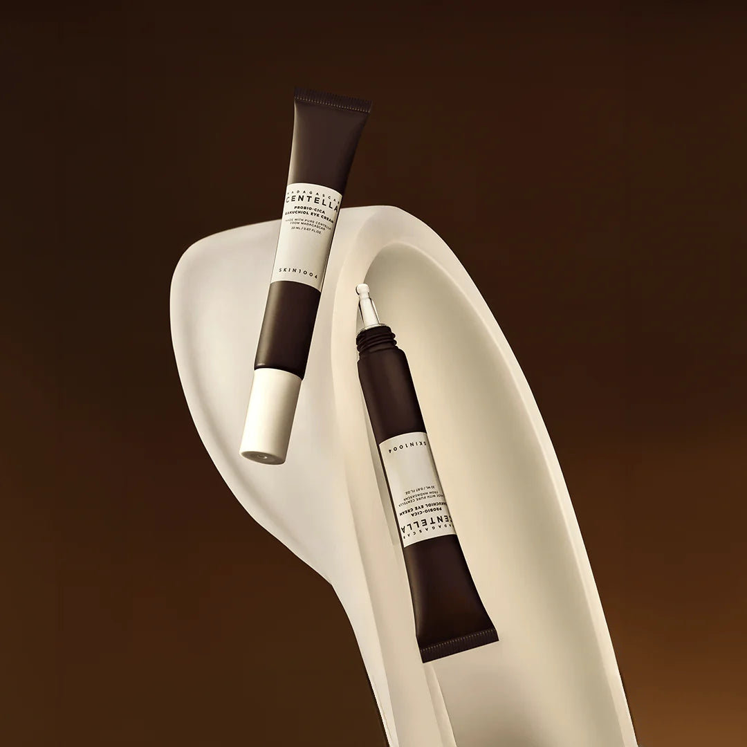 SKIN1004 Bakuchiol Eye Cream - Both Applicator Styles on Sculptural Surface